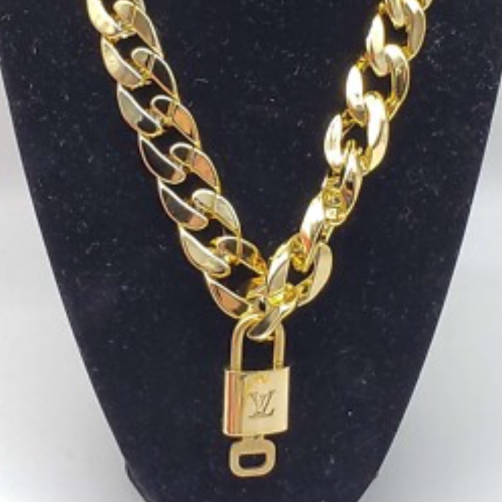 LOUIS VUITTON LOCK AND KEY *****CHAIN IS FREE*****